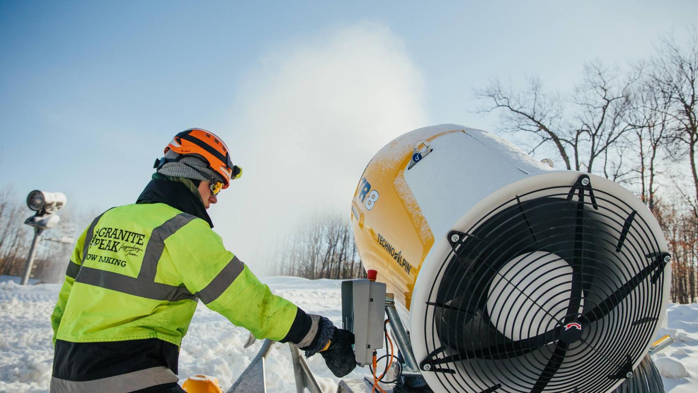 Snowmaker at Granite Peak checks on one of the fan guns.