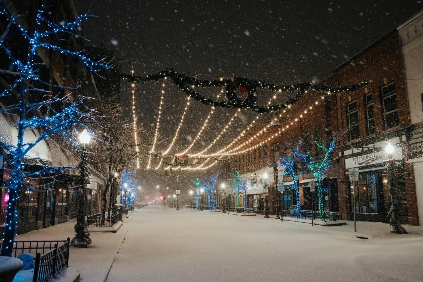 christmas lights under a snowfall in downtown wausau