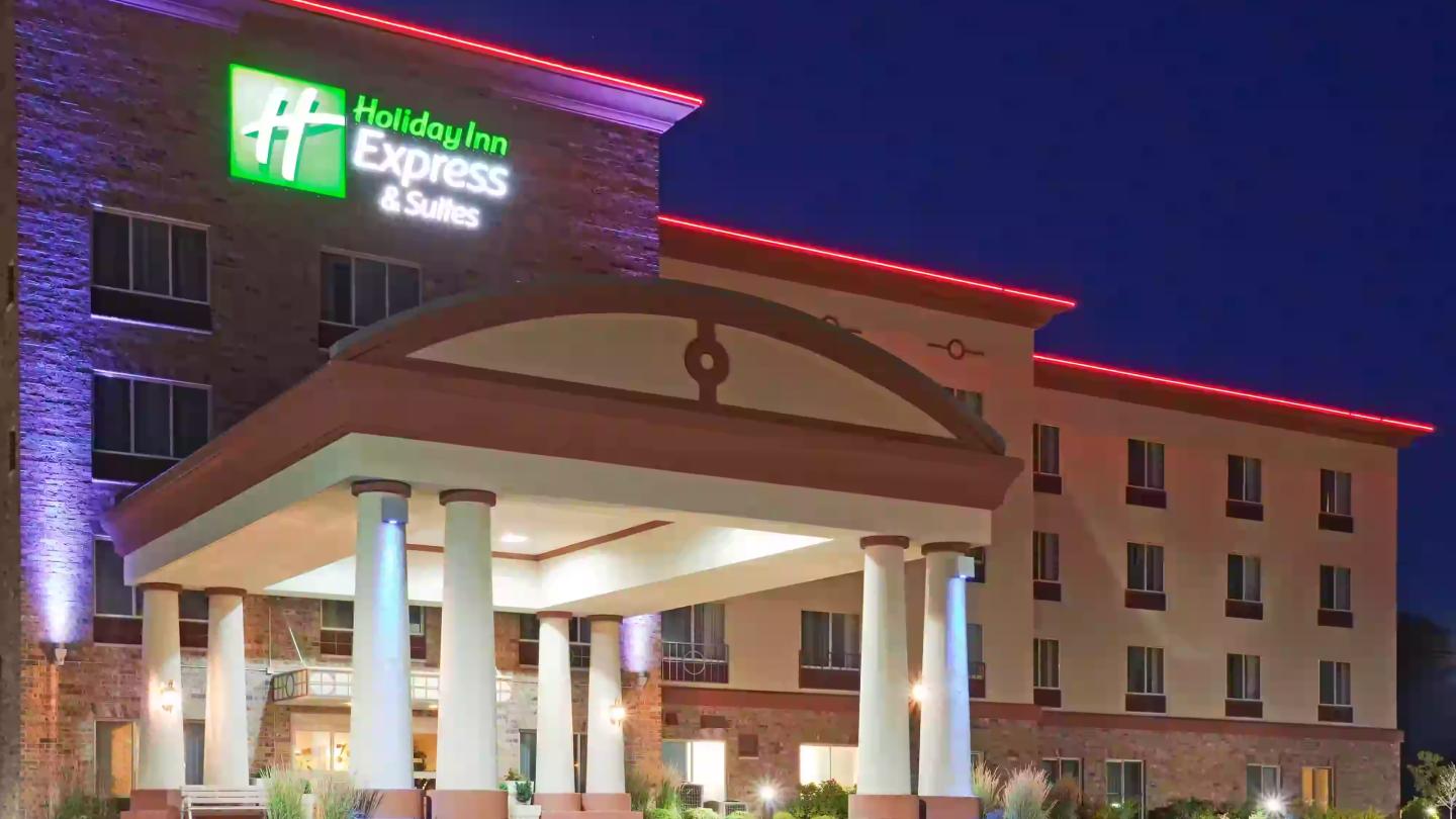 Holiday Inn Express hotel exterior at night with lit entrance.
