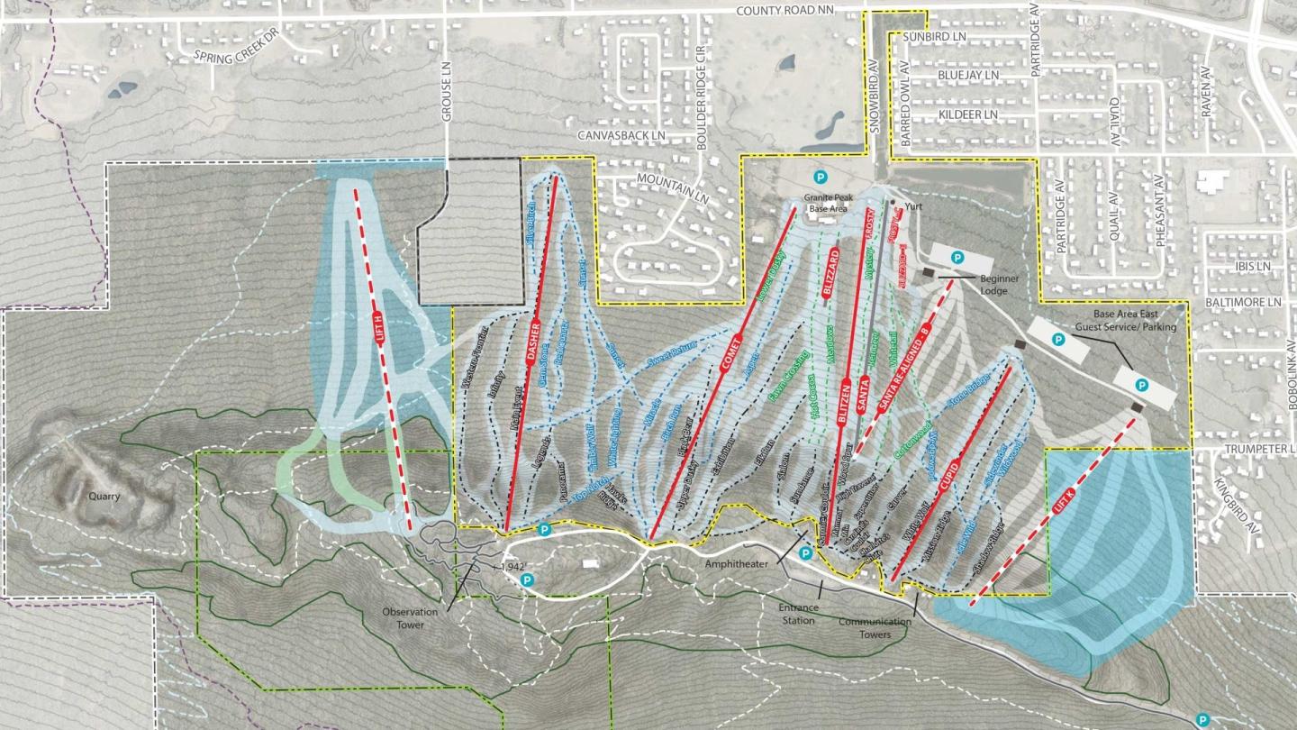 Ski resort trail map with colored slopes and paths on a mountain.